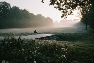 Sunrise and a person tying running shoes, symbolizing a fresh disciplined start